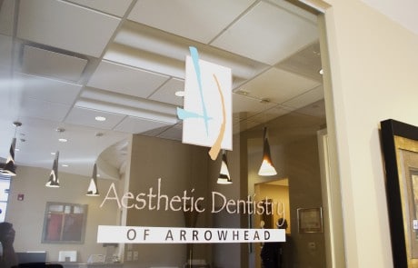Aesthetic Dentistry of Arrowhead dentist office door logo