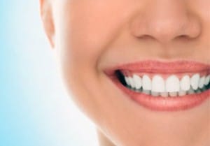 contributing factors to dark triangles between teeth