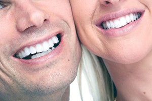 man and woman smiling after cosmetic treatments
