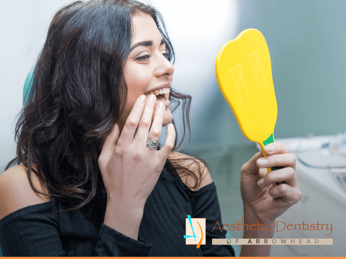 Lady checking her new dental implants
