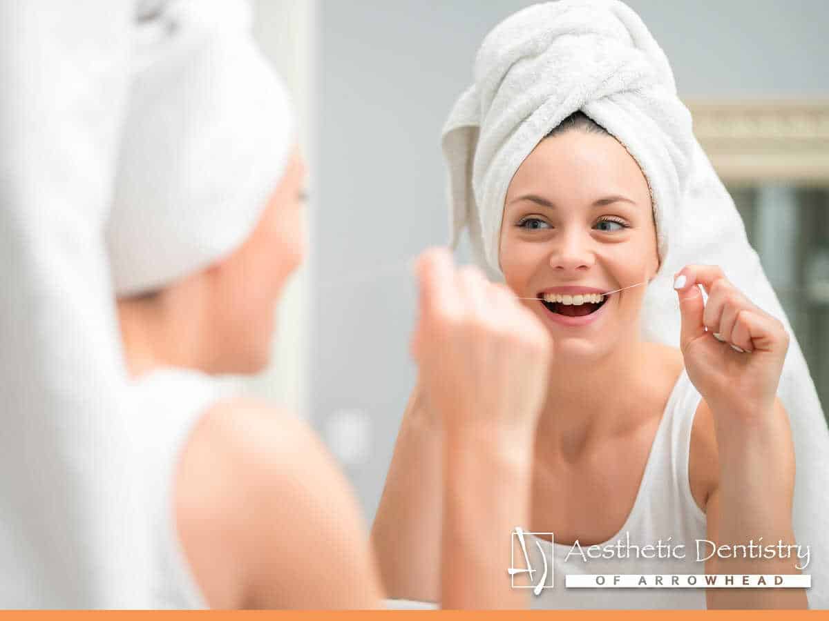 A woman taking care of her dental appliances