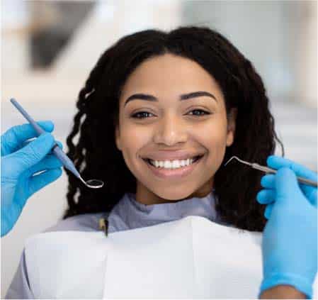 Smiling Woman After Getting Dental Crowns Near Peoria